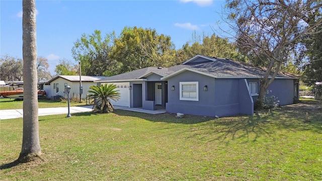 ranch-style house featuring a garage, a front yard, driveway, and stucco siding