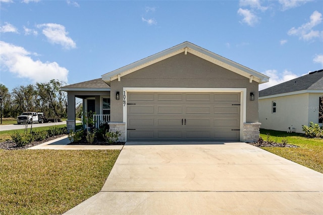 single story home with stucco siding, concrete driveway, an attached garage, stone siding, and a front lawn