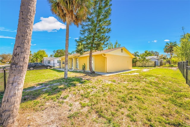 view of yard featuring fence