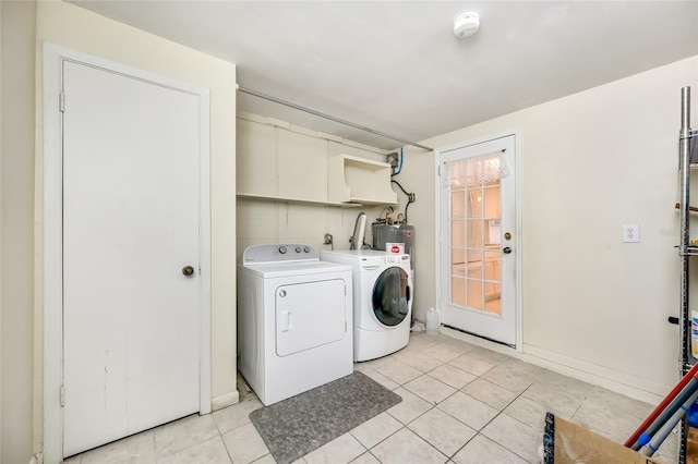 laundry area featuring washer and dryer, laundry area, and light tile patterned floors