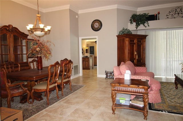 dining area featuring visible vents, baseboards, a notable chandelier, and crown molding