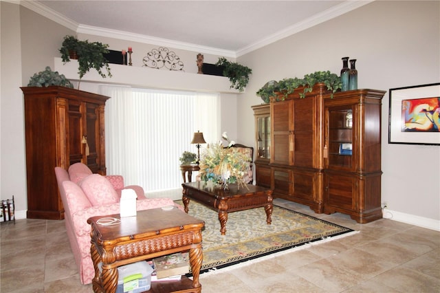 sitting room featuring baseboards and ornamental molding