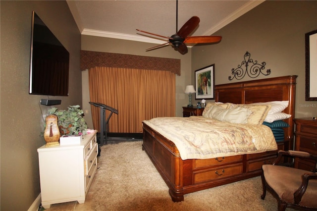 bedroom featuring light colored carpet, crown molding, and a ceiling fan