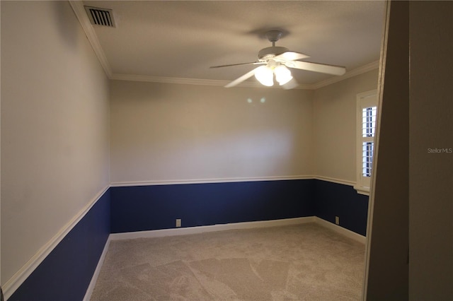 unfurnished room featuring a ceiling fan, crown molding, carpet, and visible vents