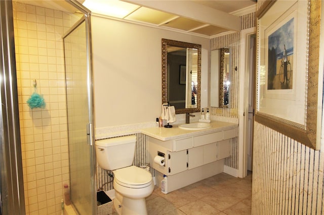 bathroom featuring toilet, a stall shower, vanity, and tile patterned flooring