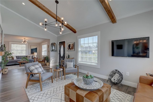 315 40th St S, Saint Petersburg, FL 33711 - living area with wood finished floors, beam ceiling, baseboards, and an inviting chandelier