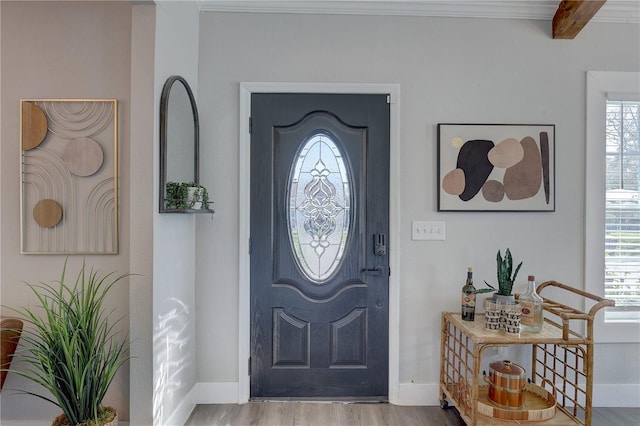 315 40th St S, Saint Petersburg, FL 33711 - foyer entrance featuring crown molding, wood finished floors, and baseboards