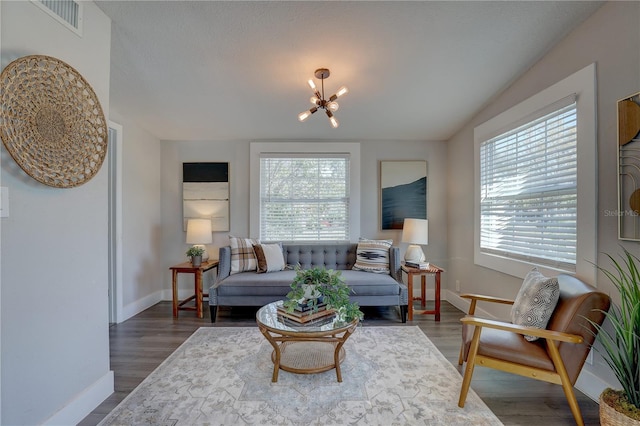 315 40th St S, Saint Petersburg, FL 33711 - living area featuring plenty of natural light, visible vents, and wood finished floors