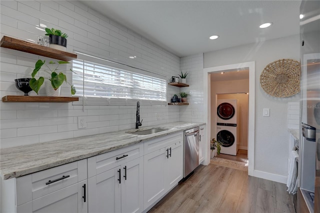 kitchen with dishwasher, light wood-style flooring, white cabinetry, open shelves, and a sink