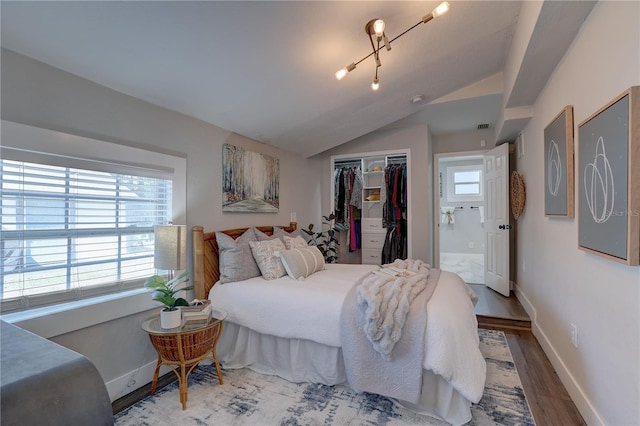 315 40th St S, Saint Petersburg, FL 33711 - bedroom featuring lofted ceiling, a closet, visible vents, wood finished floors, and baseboards