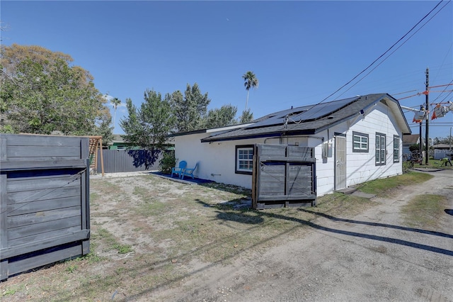 315 40th St S, Saint Petersburg, FL 33711 - exterior space featuring fence and solar panels