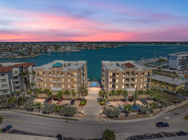 aerial view at dusk with a water view