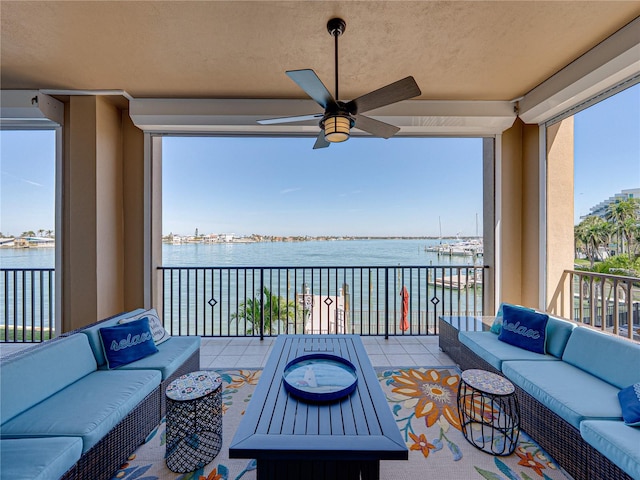 view of patio / terrace featuring outdoor lounge area, a water view, and a balcony