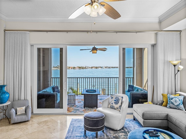 living room featuring a water view, ceiling fan, a textured ceiling, and crown molding