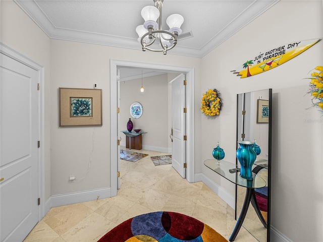 hall with a chandelier, baseboards, visible vents, and crown molding