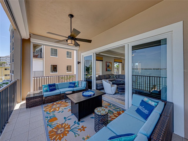 view of patio with ceiling fan, outdoor lounge area, and a balcony