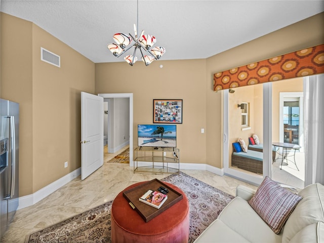 living room with visible vents, baseboards, marble finish floor, a textured ceiling, and a chandelier