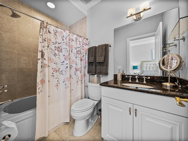 bathroom featuring shower / tub combo, vanity, toilet, and tile patterned floors