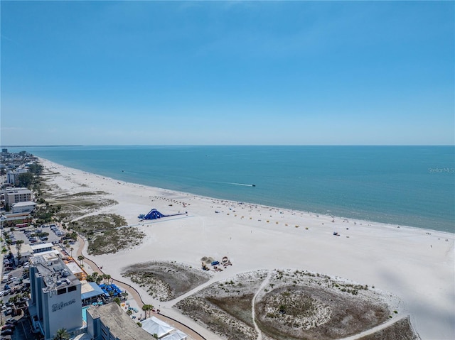 drone / aerial view featuring a water view and a beach view