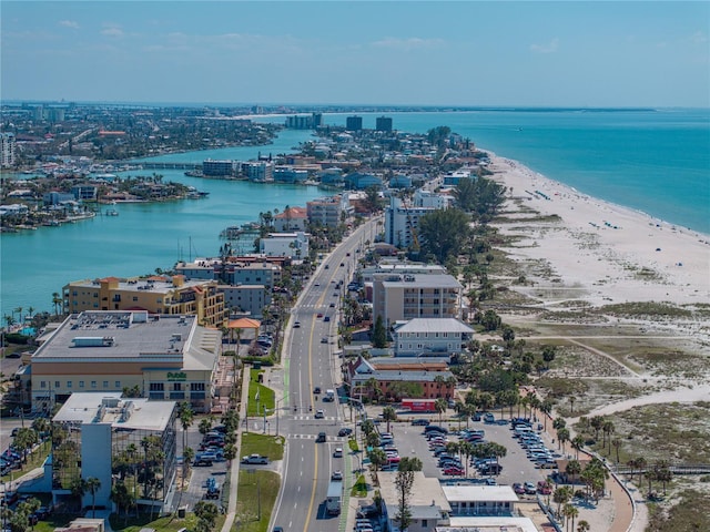 drone / aerial view featuring a view of city, a water view, and a view of the beach