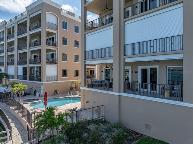 240 108th Ave Unit 102, Treasure Island, FL 33706 - view of swimming pool with a pool with connected hot tub