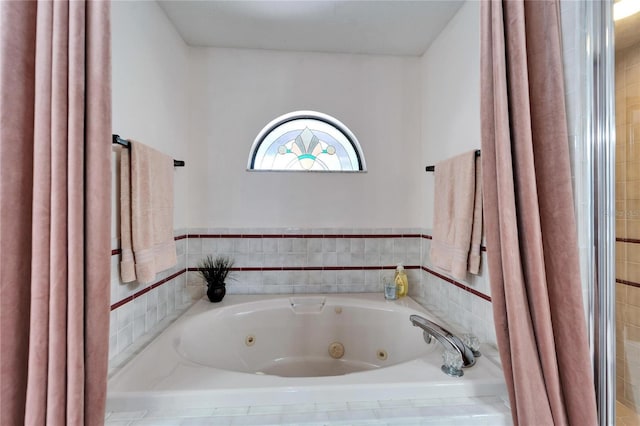 full bath featuring a whirlpool tub