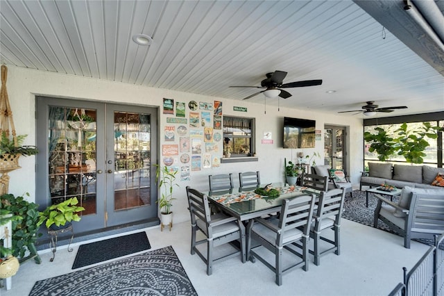 view of patio / terrace featuring ceiling fan, an outdoor living space, outdoor dining area, and french doors