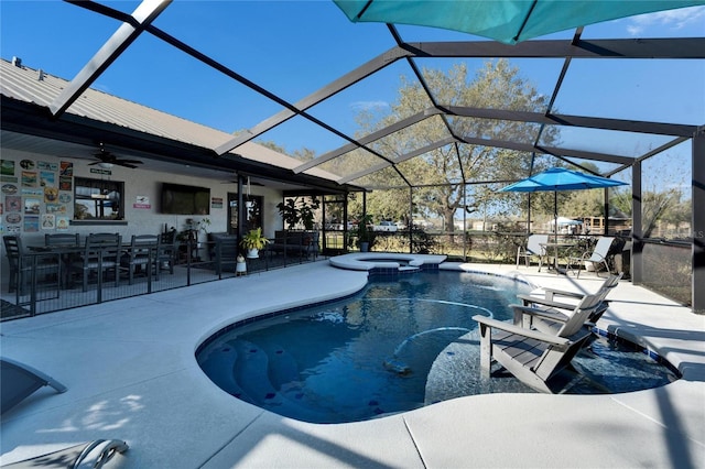 view of swimming pool featuring a lanai, a patio area, ceiling fan, and outdoor dining space