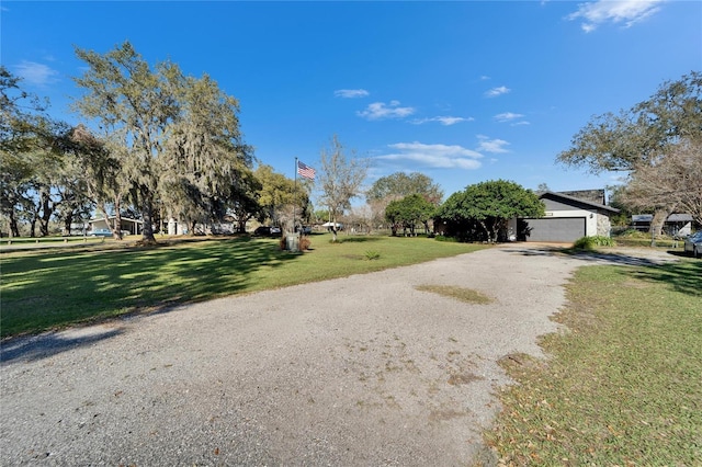 exterior space with gravel driveway