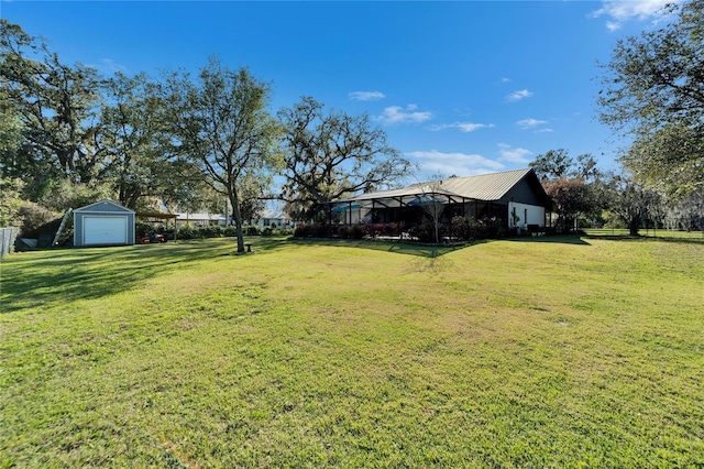 view of yard with a garage and an outdoor structure