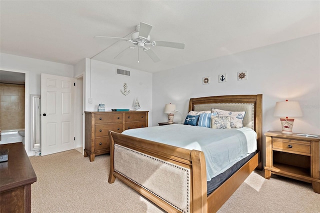 bedroom with ceiling fan, visible vents, and light carpet