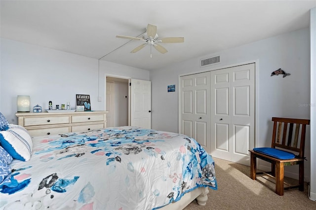 carpeted bedroom with visible vents, a closet, and ceiling fan