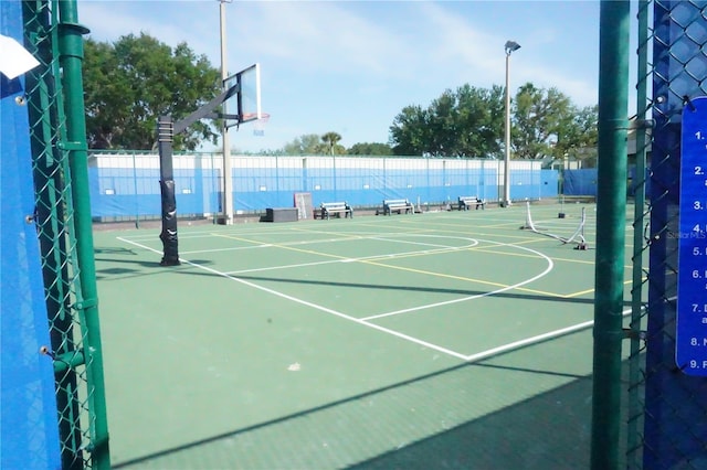 view of sport court featuring community basketball court and fence