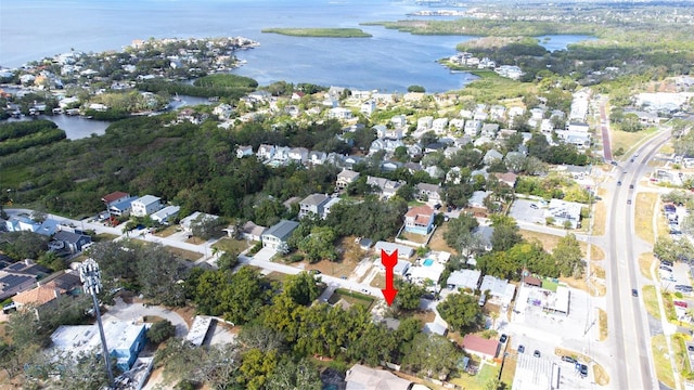 bird's eye view featuring a water view and a residential view