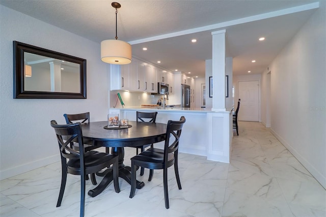 dining room featuring marble finish floor, recessed lighting, and baseboards