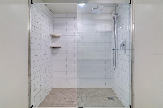 full bath featuring a stall shower and visible vents