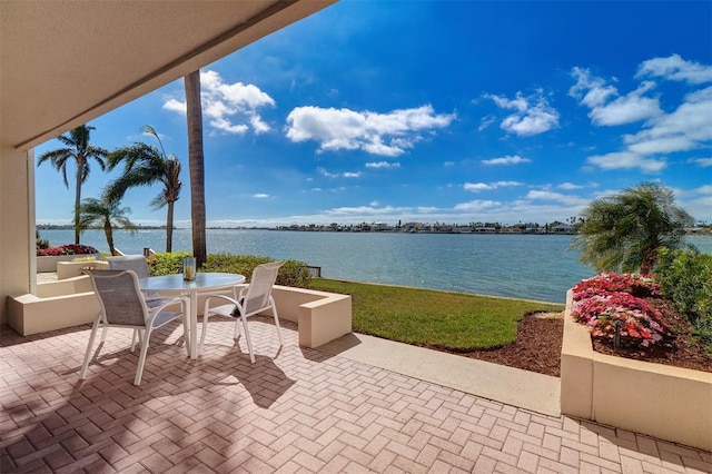 view of patio / terrace featuring outdoor dining area and a water view