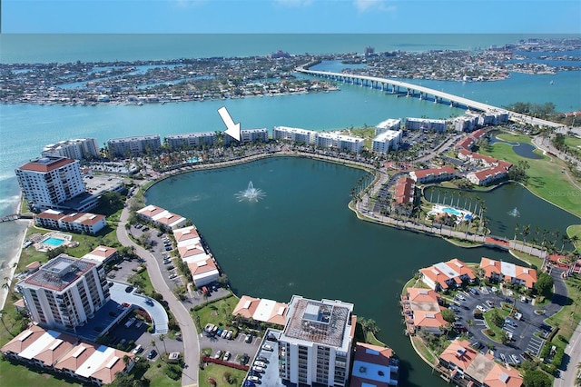 birds eye view of property with a water view and a city view