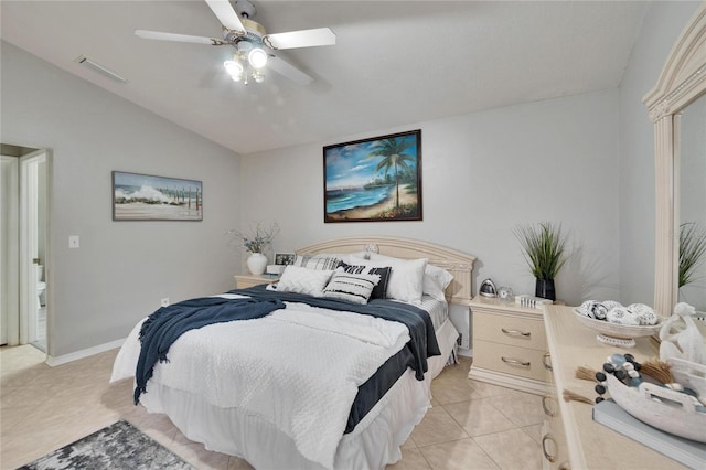 bedroom featuring vaulted ceiling, light tile patterned flooring, visible vents, and a ceiling fan