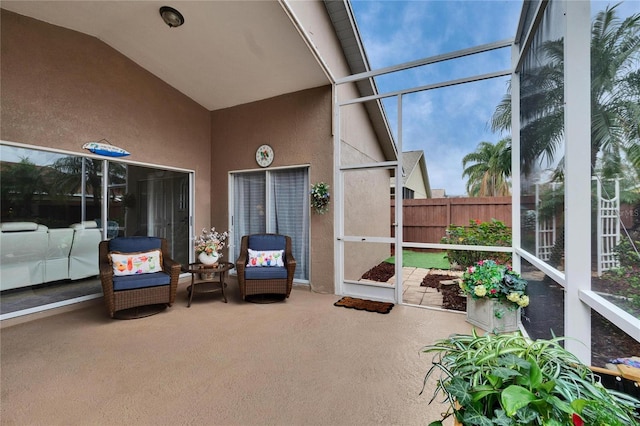 sunroom / solarium with vaulted ceiling