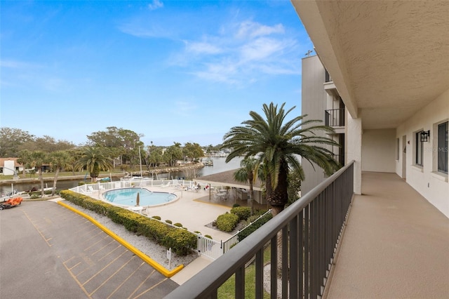 balcony featuring a water view