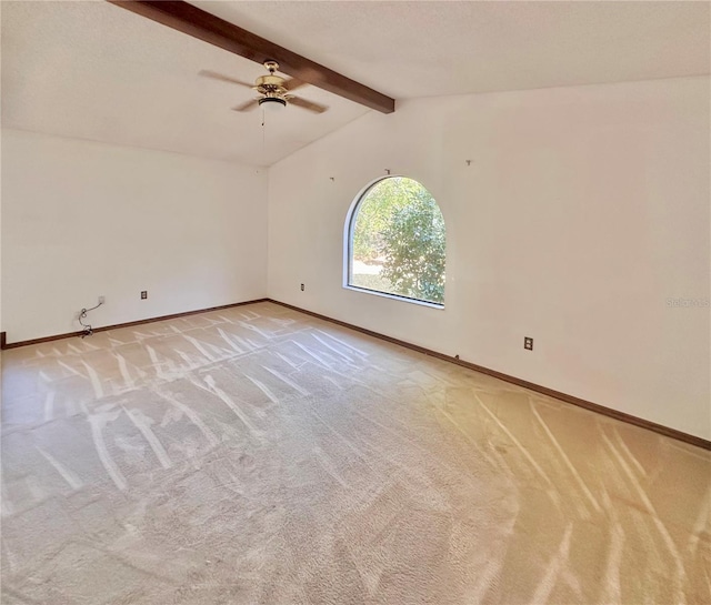 unfurnished room with light carpet, lofted ceiling with beams, baseboards, and a ceiling fan