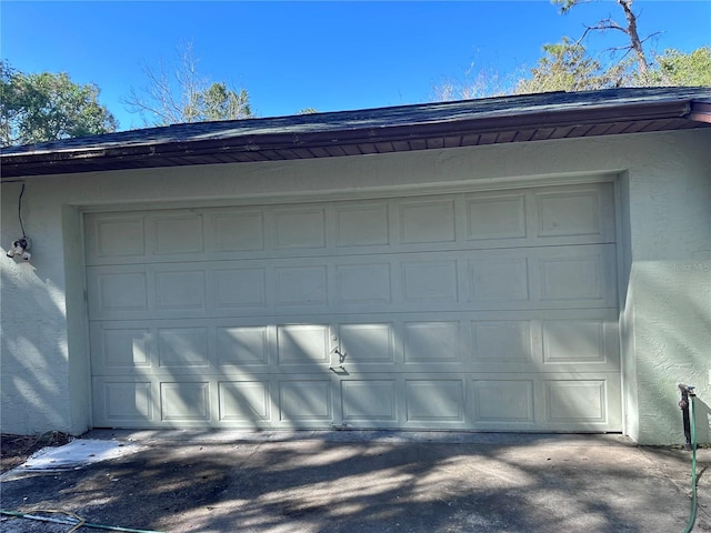 garage featuring driveway