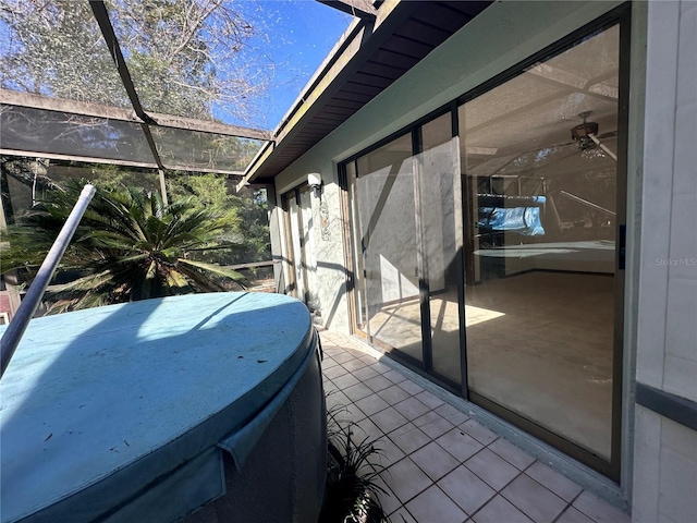 exterior space with a lanai and a jacuzzi