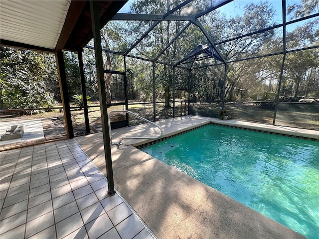 pool with a patio area and a lanai