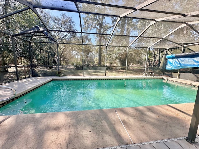 pool featuring a lanai and a patio area