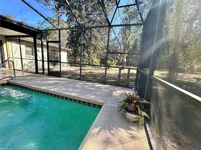 outdoor pool with a patio and a lanai