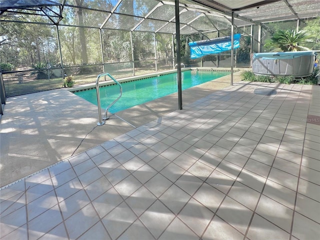 outdoor pool featuring a patio area and a lanai