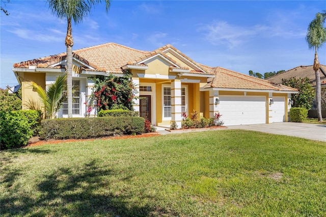 view of front of house featuring concrete driveway, a tiled roof, an attached garage, a front lawn, and stucco siding