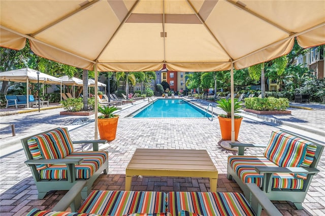 pool with a patio area